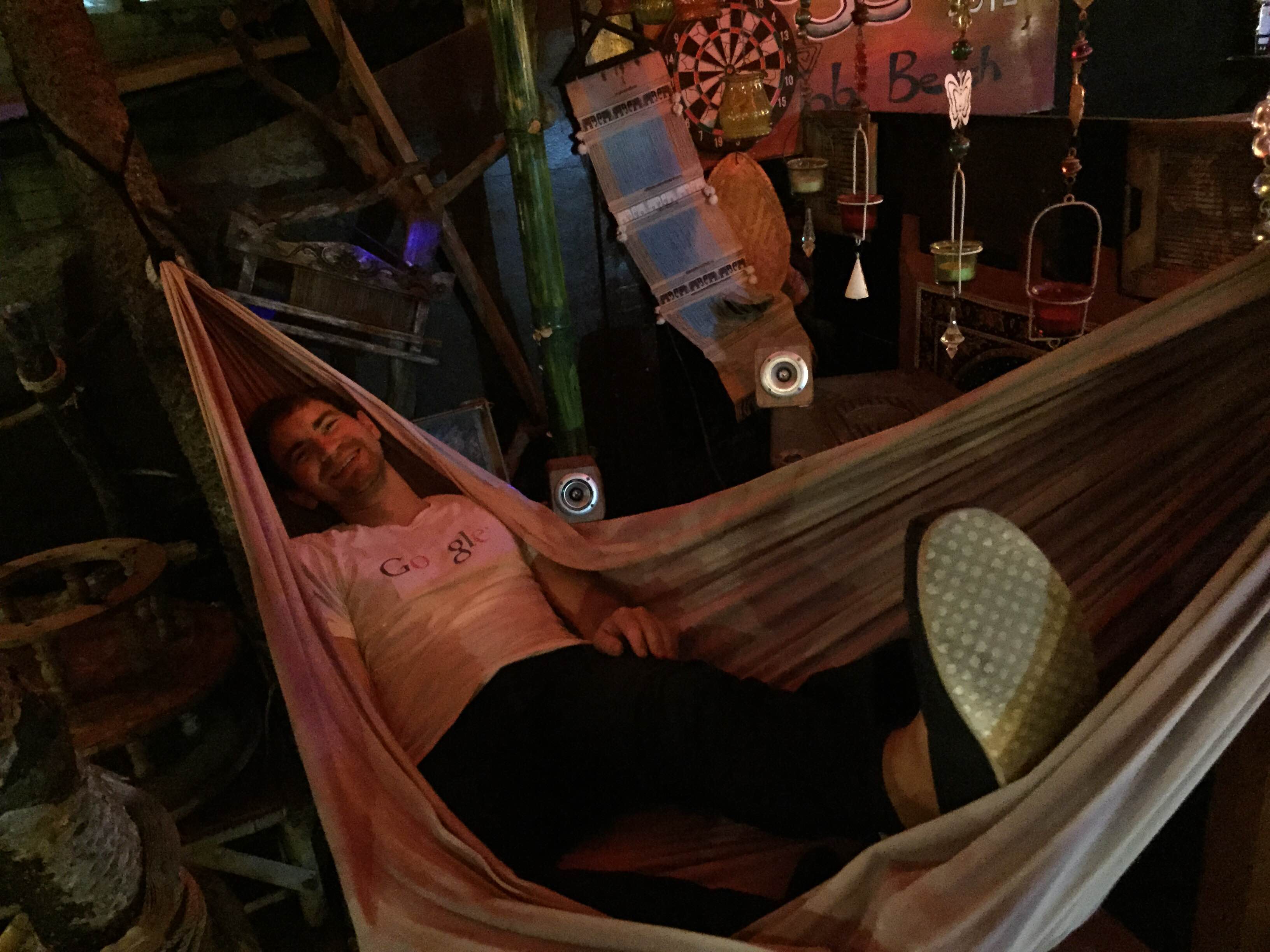 Daniel loving life in a hammock at dinner—he's been excited to get to Ko Lanta!