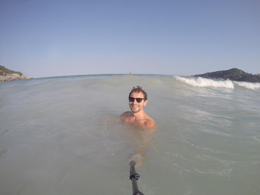 Daniel playing in the waves with his selfie stick (waves not pictured). 